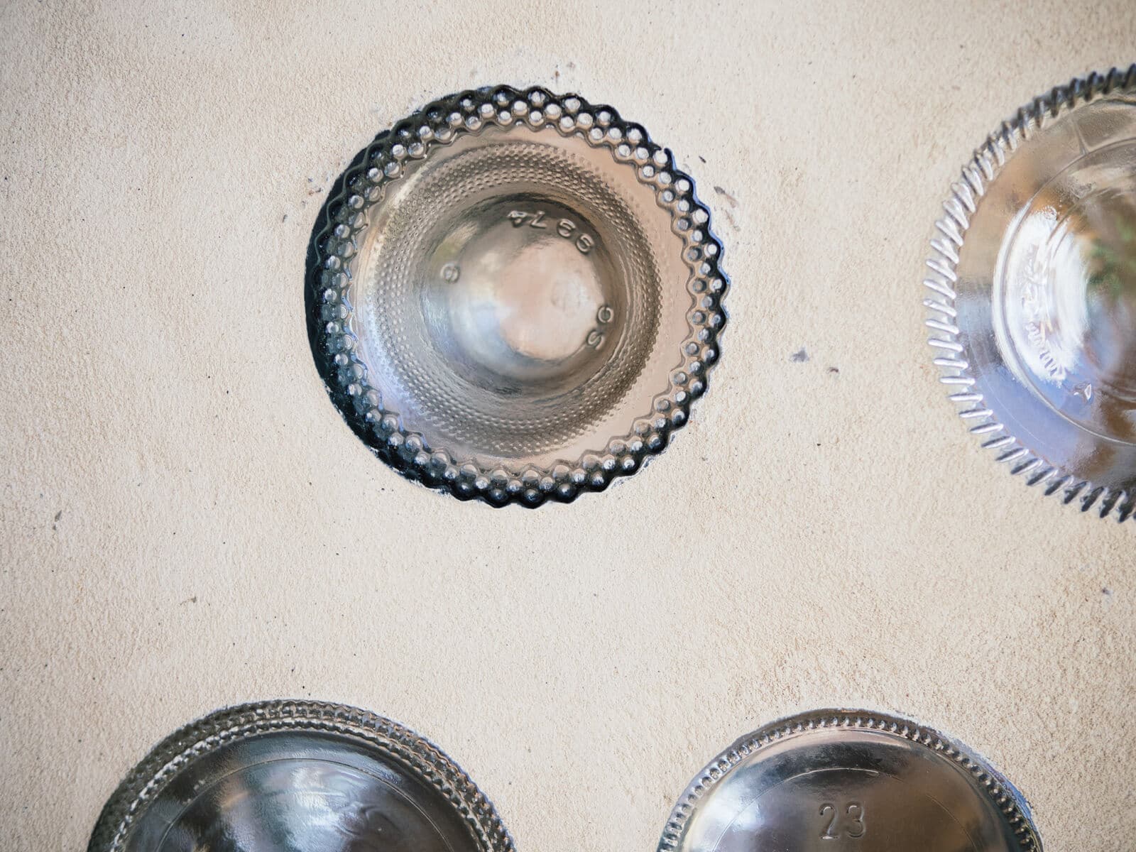 Glass bottles upcycled into an interior wall of an Earthship