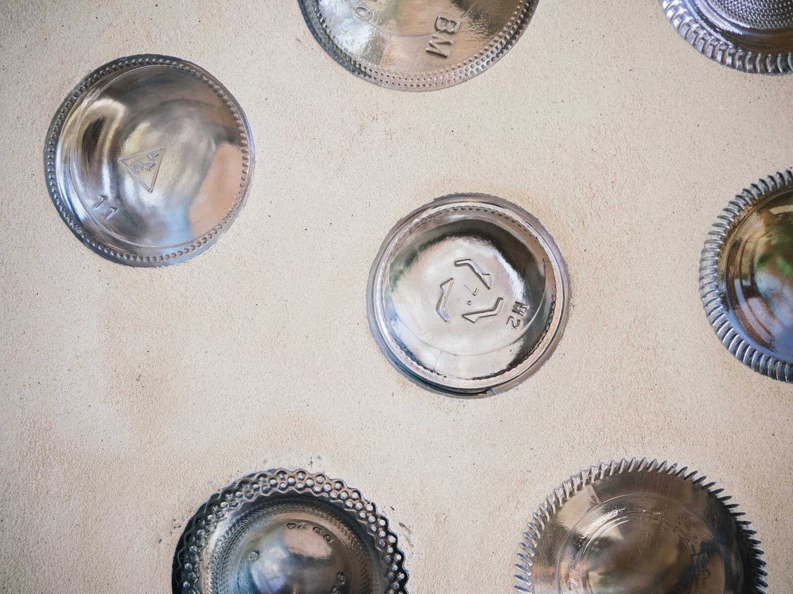 Upcycled glass bottle walls bring light into an Earthship