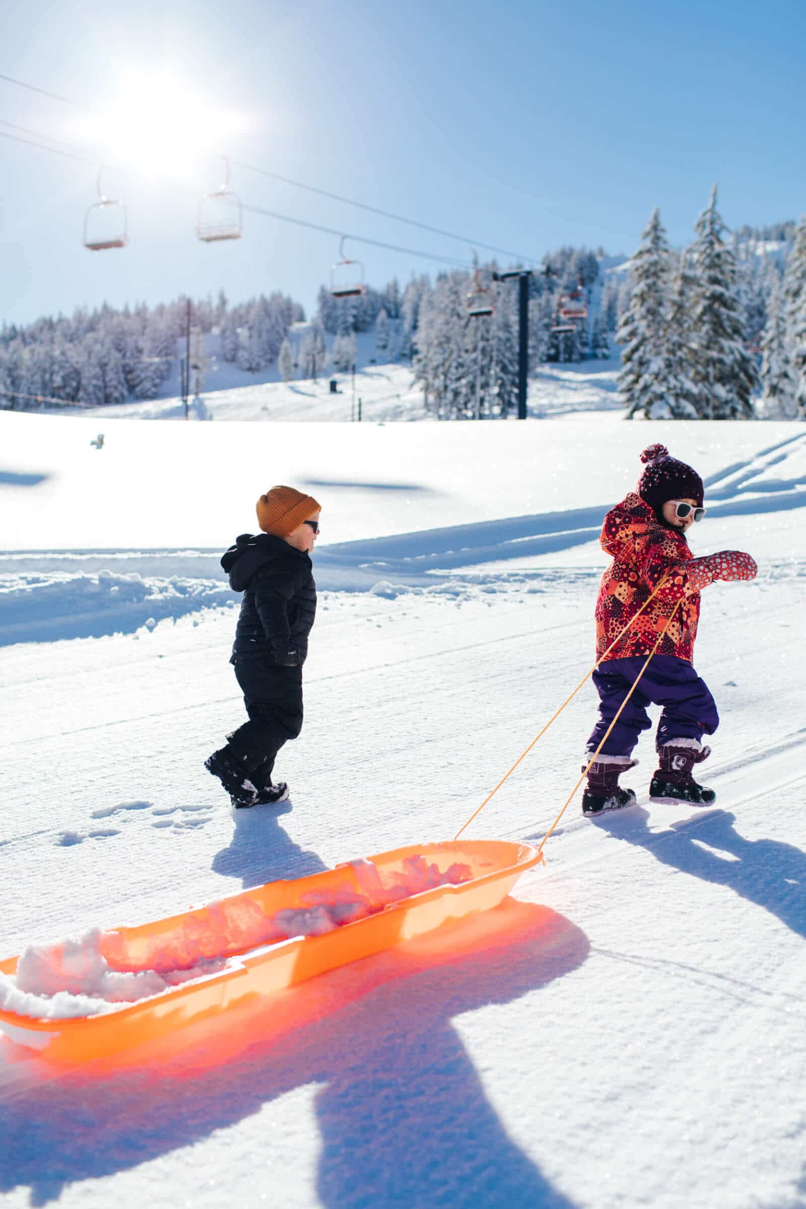 Toddlers on the sled hill