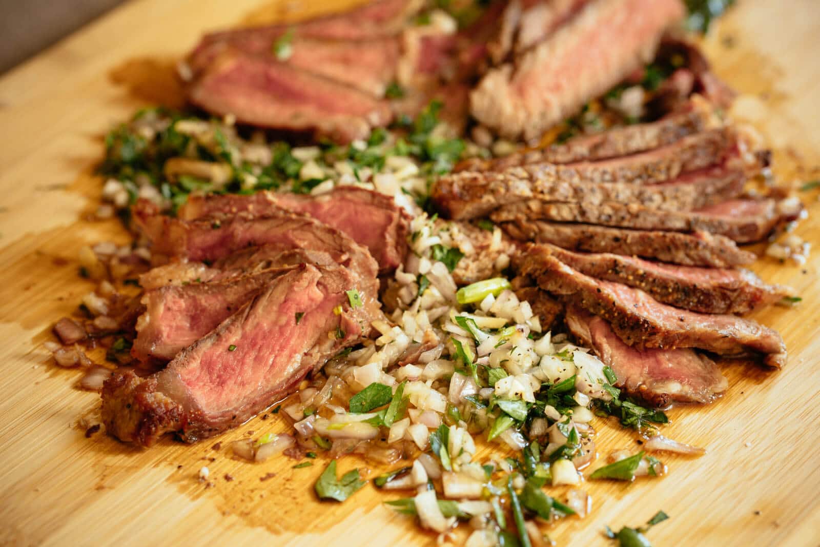 Seared rib-eye steaks with herbed board sauce