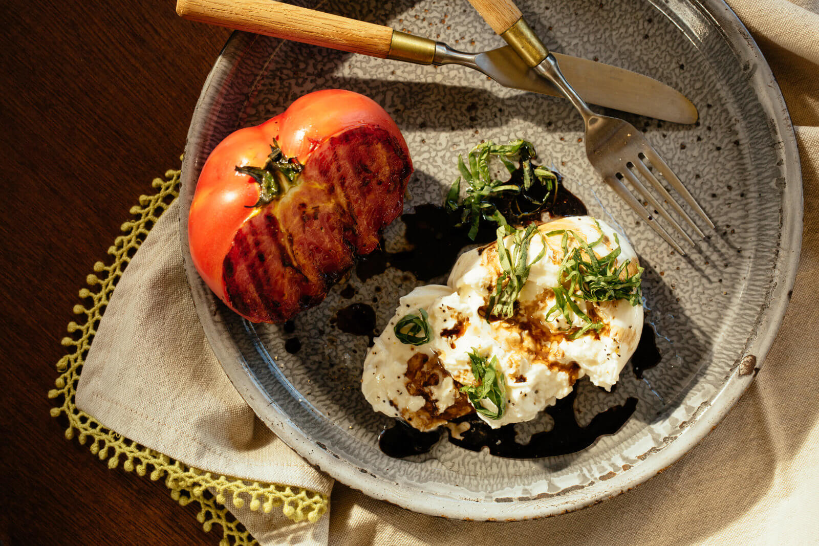Seared beefsteak tomato with burrata