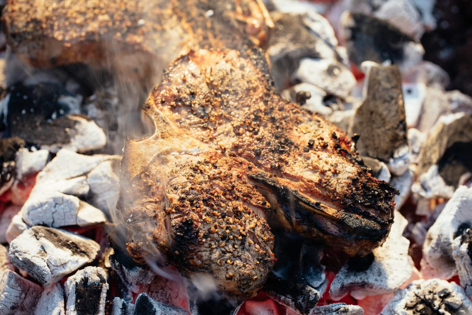 Cavemean steak cooked on the coals