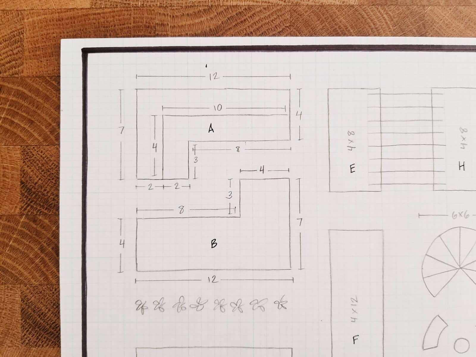 Close-up of garden plan showing tiered raised beds in the corner of the garden