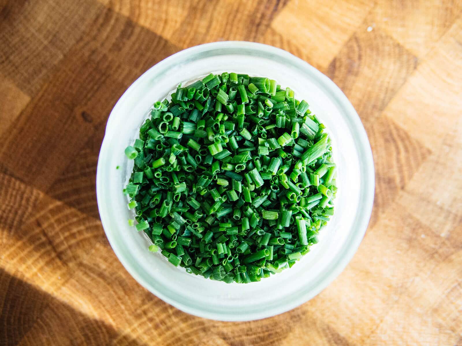 Aerial view of frozen chives in a mason jar