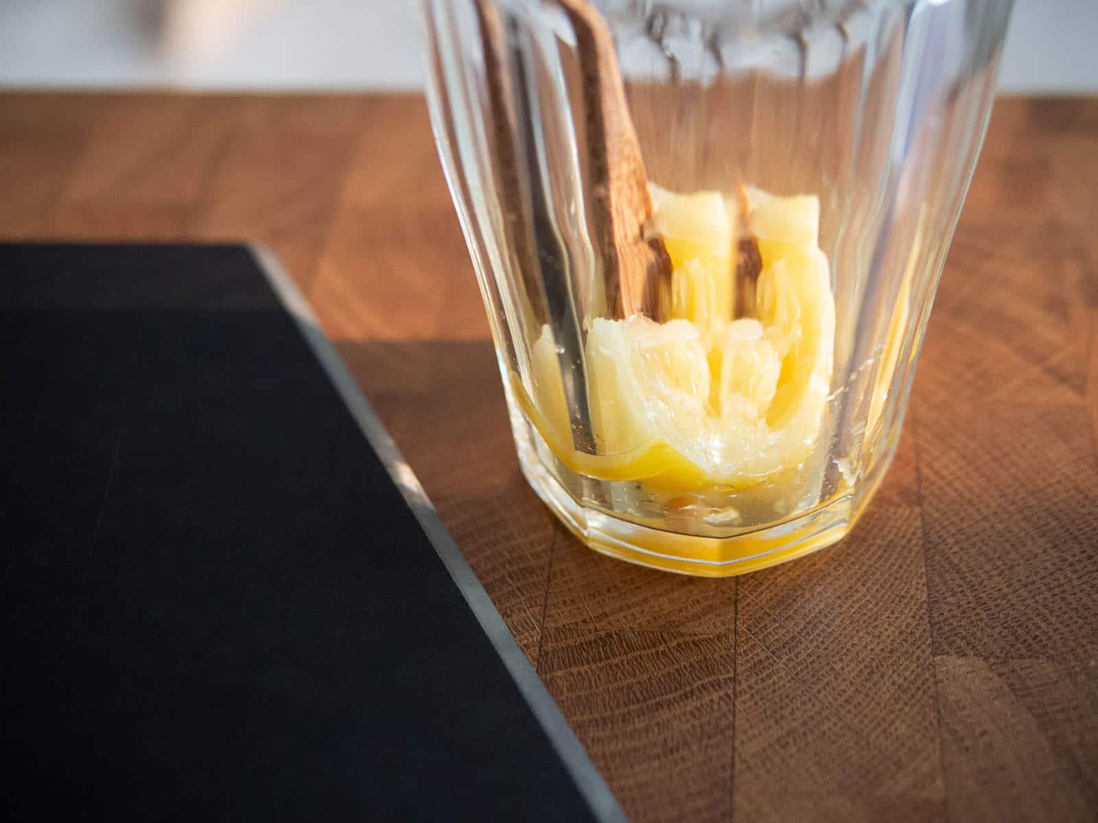 Mashed lemon on the bottom of a glass