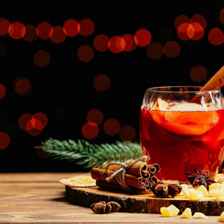 Glass of mulled wine on a wooden platter