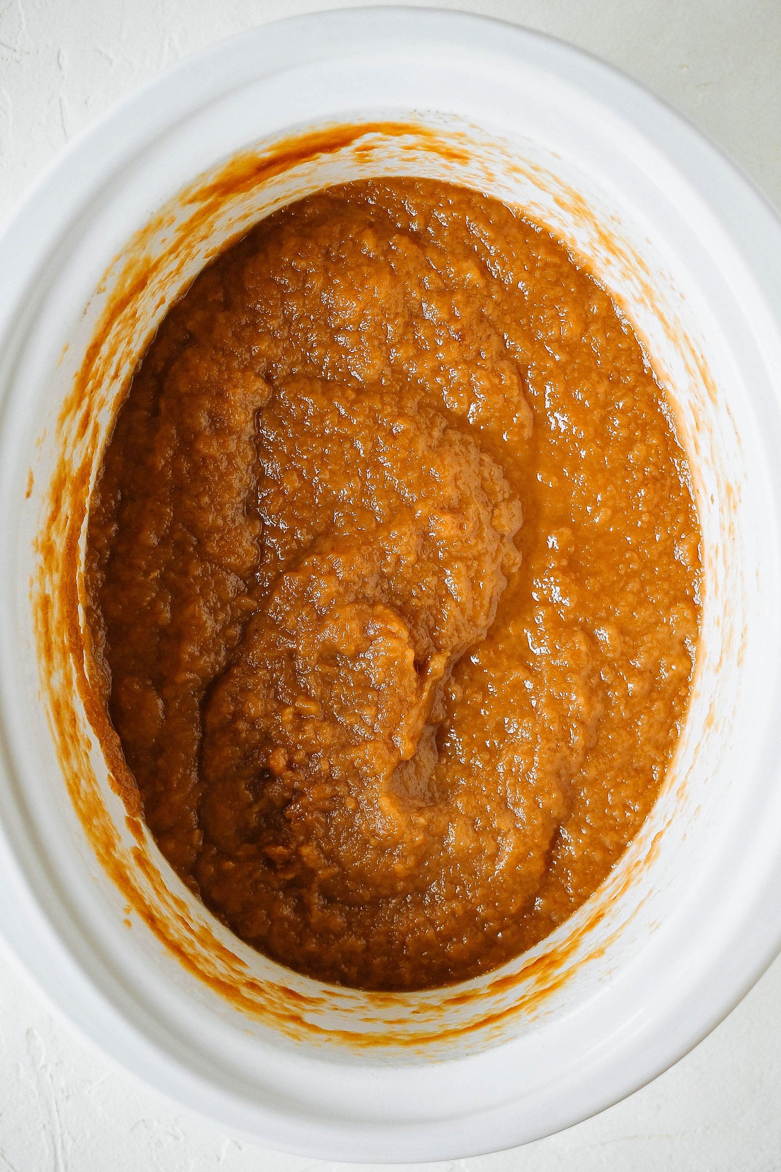 Overhead shot of slow cooker with pureed apple-pear mixture
